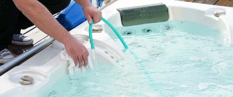 Hotel staff worker cleaning the pool